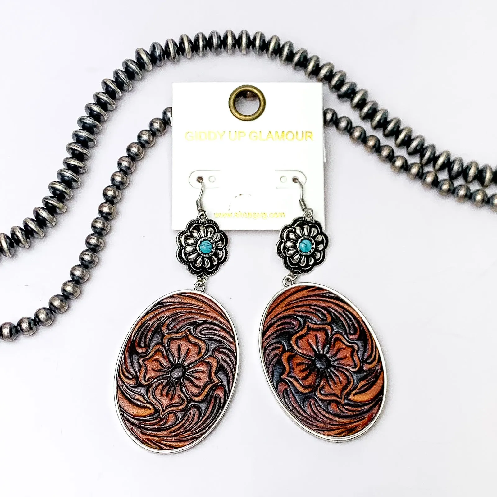 Showtime Style Dangle Earrings with Faux Leather Tooled Pendant